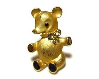 Adorable scruffy bear with bow and black eye, in matte and gloss gold tone finish