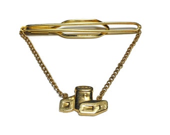 Hickok canister tie clasp with chandelier chain, canisters with a keystone symbol on them, gold tone