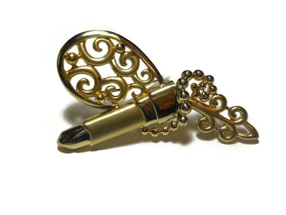 Don Lin lipstick mirror brooch, matte brush gold finish, lovely scroll work, unique style for Don Lin, 1980s