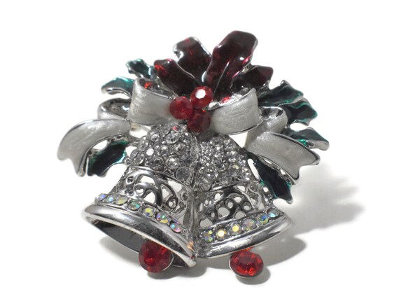 Christmas bells brooch pendant, silver bells with red moveable clappers, with a white enamel bow and red holly, clear red and AB rhinestones