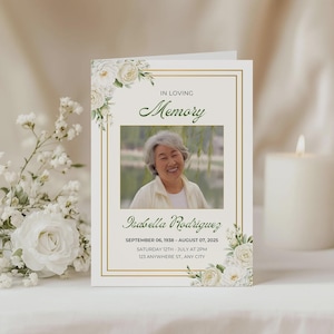 May include: A memorial card with a photo of a smiling woman, framed by a gold border and floral accents. The text reads "In Loving Memory" and includes the name Isabella Rodriguez, dates, and event details.