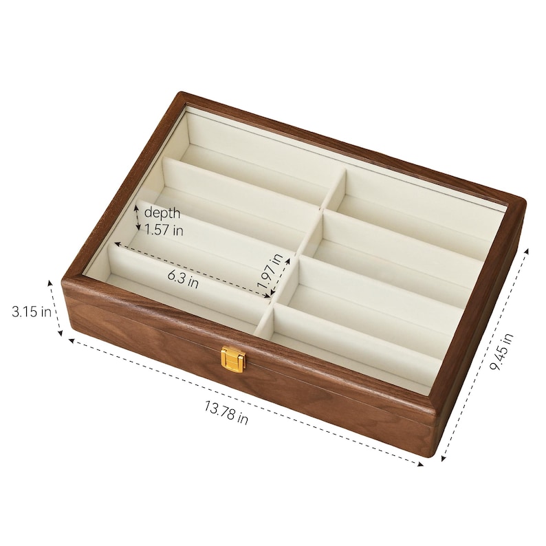 May include: A rectangular wooden storage box with a glass lid and a gold-tone latch. The interior features eight compartments lined in cream fabric. Dimensions are 13.78 inches long, 9.45 inches wide, 3.15 inches high, with 6.3 by 1.97 inch slots.