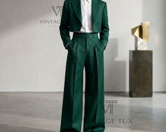 May include: A dark green suit consisting of a cropped blazer with notched lapels and high-waisted wide-leg trousers. The ensemble is paired with a crisp white button-down shirt. The text VINTAGE TUX RETRO STITCHED is visible in the upper left corner.