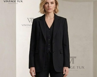 May include: A black three-piece suit consisting of a tailored blazer with notched lapels, a button-front vest, and matching trousers. The blazer features two front buttons and flap pockets. The text VINTAGE TUX RETRO STITCHED is visible.