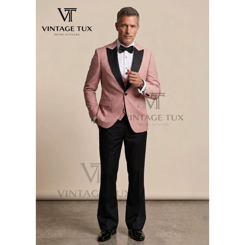 May include: A formal suit with a pink jacket, black lapels, and black pants. The jacket has a two-button closure and a black bow tie. The suit is from Vintage Tux.