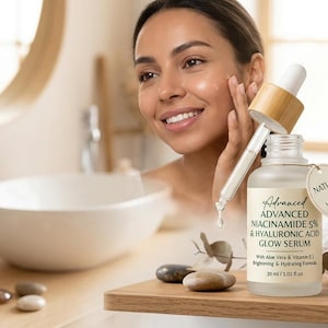 May include: A woman applying serum from a glass bottle with a dropper. The bottle is labeled "Advanced Niacinamide 5% & Hyaluronic Acid Glow Serum." A small succulent plant and a white towel are also visible.