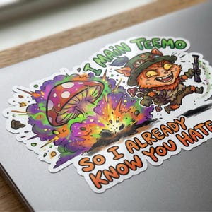 May include: A sticker depicting a cartoon character with a hat and weapon, running from an exploding mushroom. Text says "I main Teemo" and "So I already know you hate". The design features vibrant colours and a dynamic composition.