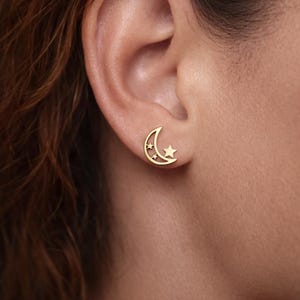 Gold-tone moon and star earrings in stainless steel