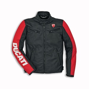 May include: Black motorcycle jacket with red accents on the sleeves. The jacket features the Ducati logo on the chest and the word "DUCATI" in white on the left sleeve. It has a zippered front and pockets.