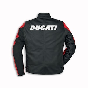 May include: Black motorcycle jacket with red accents on the sleeves. The word "DUCATI" is printed in white across the back. The jacket has a stand-up collar and adjustable waist straps.