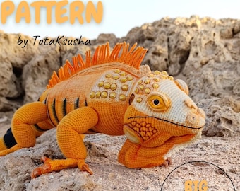 May include: A crocheted iguana in orange, yellow, and white, displayed on a rocky surface. The iguana has detailed stitching, including scales and spines. Text on the image reads "BIG IGUANA crochet PATTERN" and "BIG LIFE SIZE".