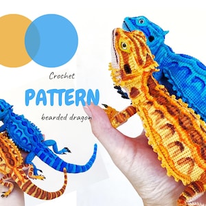 May include: Two crocheted bearded dragon toys, one orange and brown and one bright blue, are displayed. The text Crochet PATTERN bearded dragon is printed in the center. The toys feature detailed textured scales and long tails.