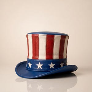 May include: A patriotic Uncle Sam hat with a blue brim and crown. The hat features red and white vertical stripes on the main body and a blue band with white stars. A classic American symbol.