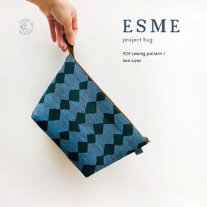 May include: A blue and green patterned project bag with a brown zipper and handle. The bag has a diamond pattern and the text "ESME project bag PDF sewing pattern / two sizes".