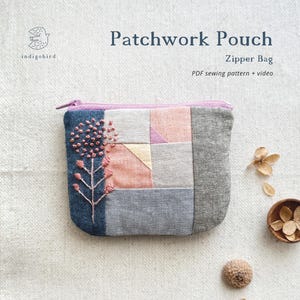 May include: Patchwork pouch with a zipper, featuring a floral embroidery design. The bag is made of various fabric squares in shades of blue, gray, pink, and yellow. The text "Patchwork Pouch" and "Zipper Bag" are visible.