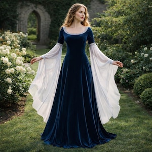 May include: A long, dark blue velvet gown with white, flowing sleeves. The dress features a scoop neckline with silver trim and a fitted bodice that flares into a full skirt. The sleeves are long and billowy, creating a dramatic silhouette.
