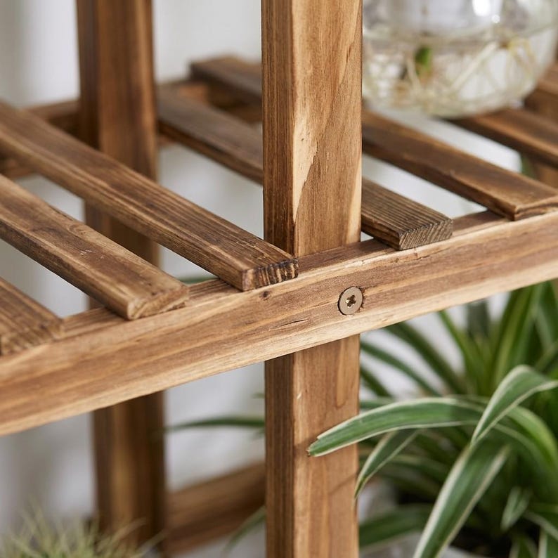 Close-up of the natural pine wood texture and slatted shelf design