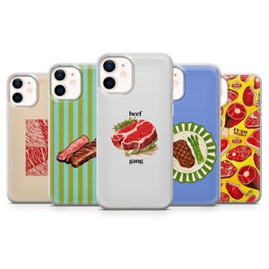 May include: Five clear smartphone cases featuring various meat-themed designs. One shows a red marbled texture, another green stripes with steak, one has a raw steak with the text beef gang, one a grilled steak on a plate, and one a yellow meat pattern.