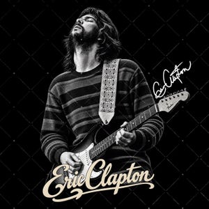 May include: A black and white graphic print featuring a portrait of Eric Clapton playing an electric guitar with a patterned strap. The image includes the text Eric Clapton in a stylized script font at the bottom and a signature on the right side.
