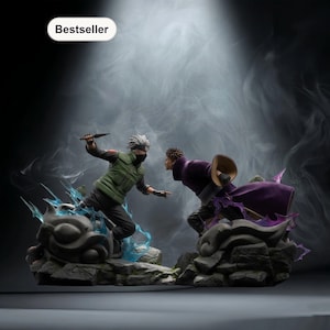 May include: A detailed figurine depicting two characters in a dynamic battle pose. One figure is in a green vest and black pants, holding a knife. The other figure is in a purple cloak. The base is a rocky landscape with blue and purple energy effects.