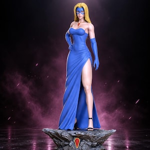 May include: A blonde figurine wearing a strapless blue gown with a high side slit, matching blue opera gloves, and a blue eye mask. The character wears a red pendant necklace and black high-heeled sandals, standing on a rocky base.