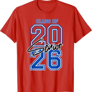 May include: A red t-shirt with the text "CLASS OF 2026 Senior" in blue and white lettering. The shirt is a classic crew neck style, suitable for casual wear. The design is centered on the front of the shirt.