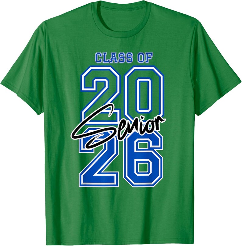 May include: Green t-shirt with the text "CLASS OF 2026 Senior" in blue and white lettering. The word "Senior" is in a cursive font. The shirt is a crew neck style.
