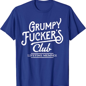 May include: Royal blue t-shirt with the text "Grumpy Fucker's Club" in a distressed white font. Below the club name, the text "Lifetime Member" is displayed in a smaller font.