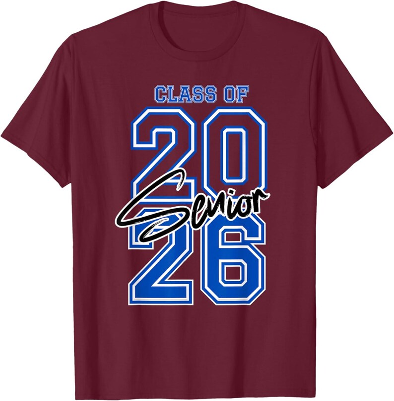 May include: Burgundy t-shirt with the text "CLASS OF 2026 SENIOR" in blue and white. The numbers "20" and "26" are large and outlined in blue. The word "Senior" is in a cursive font.