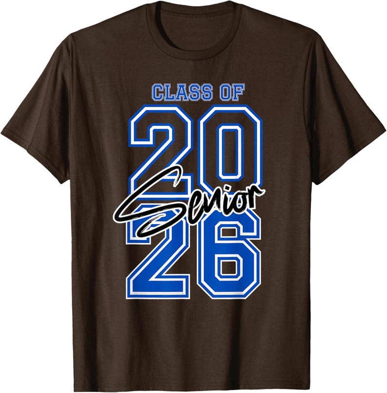 May include: Brown t-shirt with the text "CLASS OF 2026 Senior" in blue and white. The word "Senior" is in a cursive font. The shirt is a classic crew neck style.