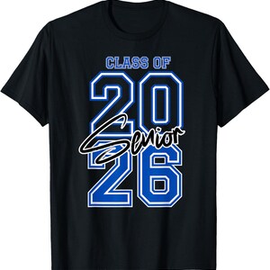 May include: Black t-shirt with the text "CLASS OF 2026 Senior" in blue and white. The shirt is a crew neck and has short sleeves. The text is in a bold, blocky font.