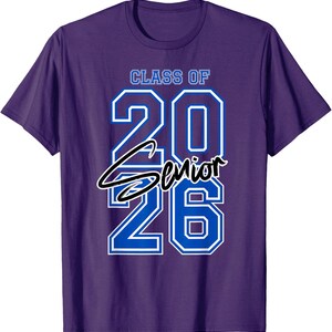 May include: Purple t-shirt with the text "CLASS OF 2026 Senior" in white and blue. The shirt is a crew neck style and is made of a soft material.