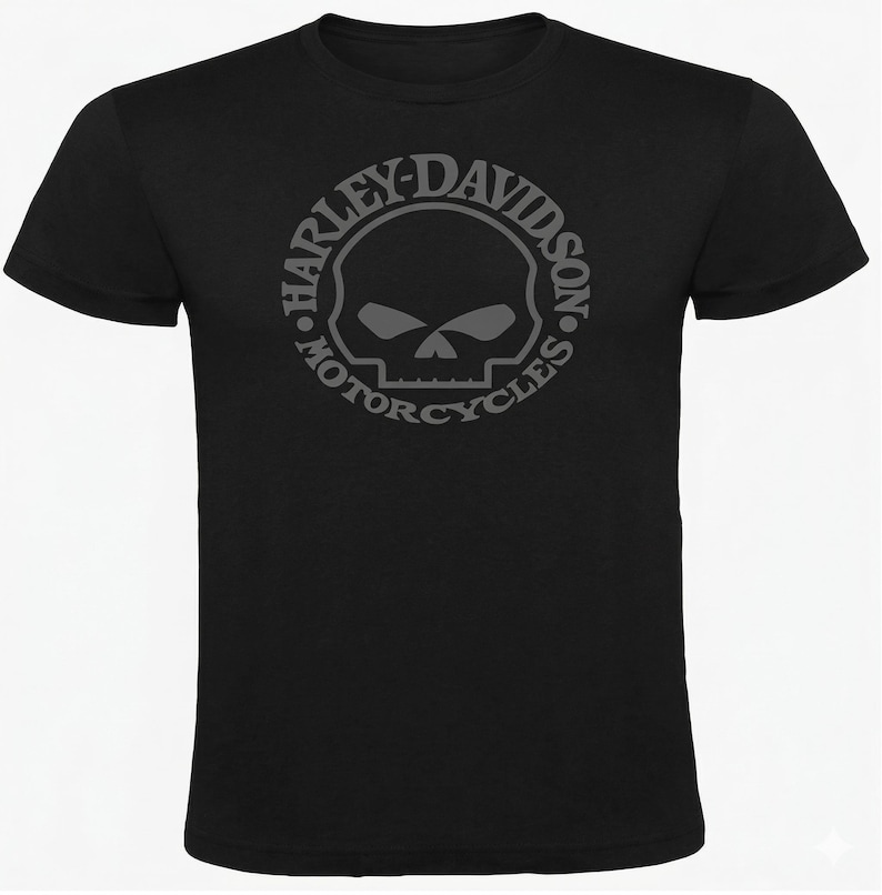 May include: Black t-shirt featuring a gray Harley-Davidson Motorcycles logo. The logo is a skull within a circular design, with the brand name and "Motorcycles" encircling the skull. The shirt has short sleeves and a crew neck.