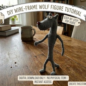 May include: A handmade gray wire-frame wolf figurine with a red nose and large eyes stands on a wooden table. The image includes text that reads "DIY WIRE-FRAME WOLF FIGURE TUTORIAL" and "STEP-BY-STEP PDF GUIDE". The figurine is a DIY project.