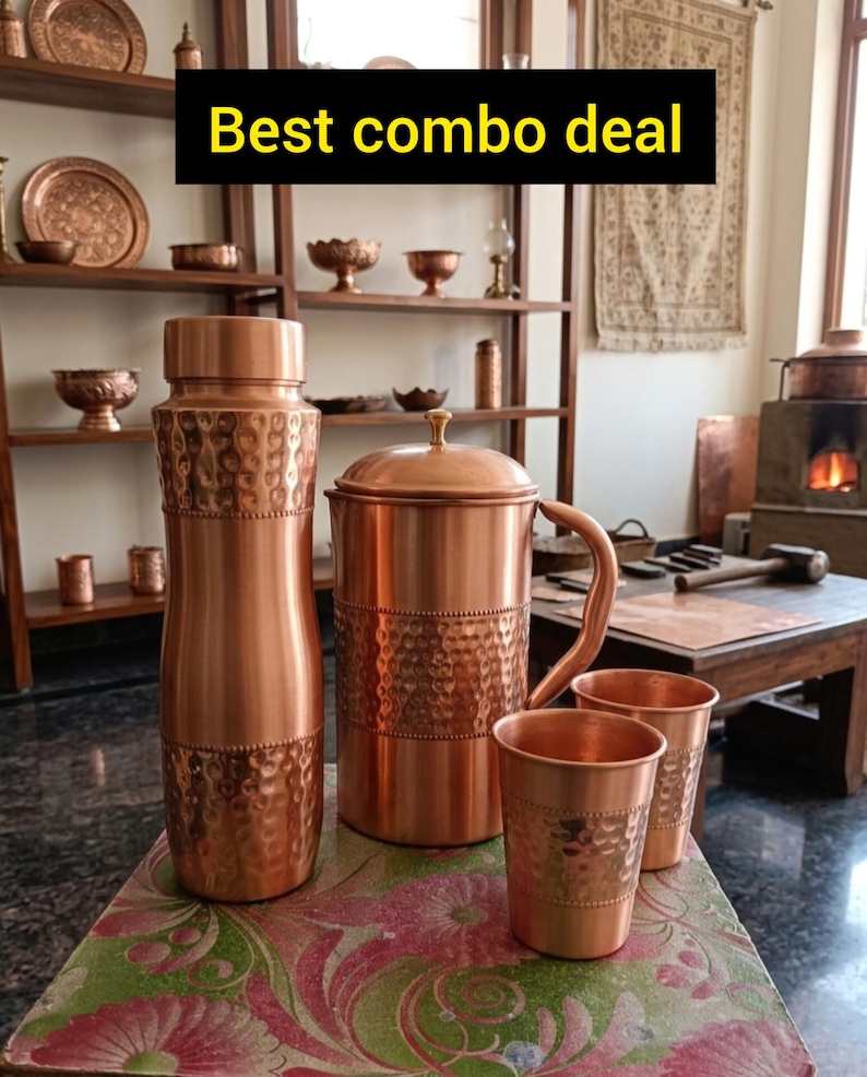 May include: A copper set featuring a tall water bottle, a lidded pitcher with a handle, and two tumblers. Each item displays a hammered texture on the middle section and a smooth finish on the top and bottom. The text Best combo deal is visible.