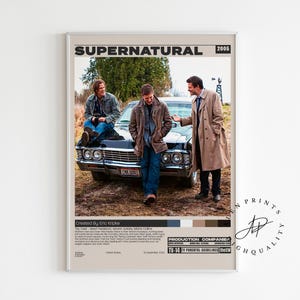 May include: A framed poster featuring the title "Supernatural" and the year 2005. The image shows three people standing near a black car. The poster has a neutral color palette and includes text at the bottom.