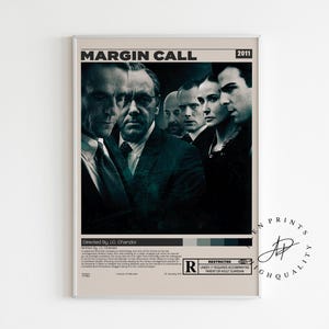 May include: A framed movie poster for "Margin Call" (2011) featuring a group of actors in dark suits. The poster has a beige background with the title at the top and a rating symbol at the bottom. The poster is rectangular and has a white border.