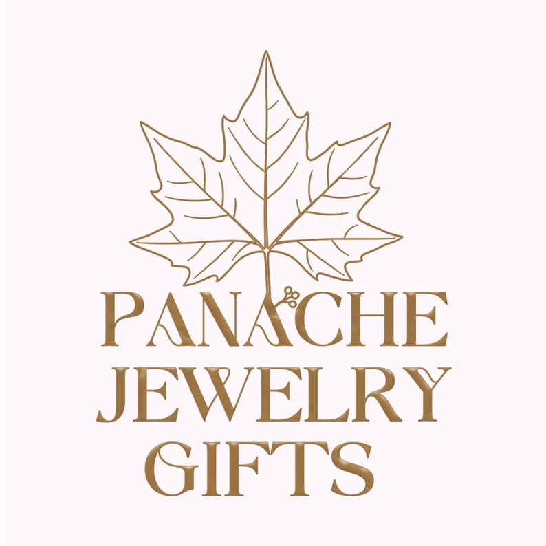 May include: A logo for Panache Jewelry Gifts, featuring a stylized gold maple leaf above the brand name. The text is in a serif font, with the words "Panache," "Jewelry," and "Gifts" stacked vertically in a gold color against a white background.