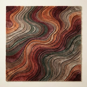 May include: A square rug featuring a textured, three-dimensional wave pattern. The design consists of flowing, undulating lines in a palette of deep burgundy, burnt orange, muted olive green, and warm taupe, creating a layered, carved effect.
