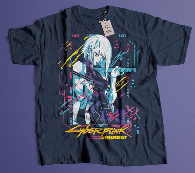 May include: Navy blue t-shirt featuring a graphic of a female anime character with white hair and a futuristic design. The text "Cyberpunk Edgerunners" is displayed in yellow and white. The shirt has a tag that says "LARGE".
