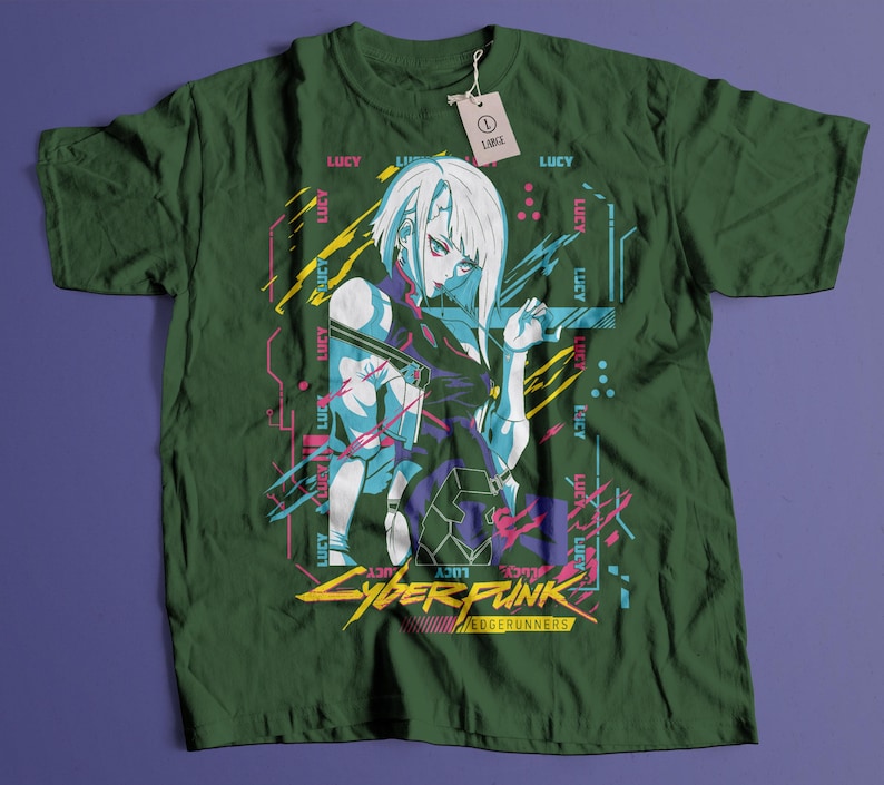 May include: Dark green t-shirt featuring a graphic of a female anime character with white hair and blue accents. The shirt has the text "CYBERPUNK EDGERUNNERS" in yellow and red. The word "LUCY" is printed multiple times on the shirt.