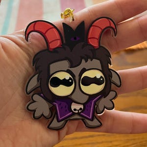 May include: A set of three ceramic mugs with a speckled, matte finish. The mugs are in shades of cream, light gray, and dark gray. Each mug has a simple, minimalist design, perfect for coffee or tea.