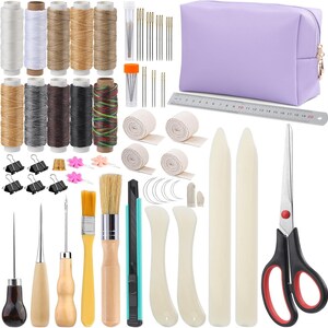 May include: A comprehensive leathercraft kit featuring spools of thread, needles, a purple pouch, a ruler, scissors, and various tools. Includes brushes, cutters, and other essential supplies for leatherworking projects. A complete set for crafting.