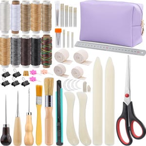 May include: A comprehensive bookbinding and leathercraft tool kit including various spools of colored thread, sewing needles in a clear case, a purple zippered pouch, a 20 cm metal ruler, scissors, bone folders, brushes, awls, and binder clips.