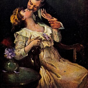 May include: Vintage illustration of a couple in an embrace. The woman is seated, wearing a light-colored dress, and the man is leaning in to kiss her. The artwork has a classic, romantic feel, with soft colors and a focus on the figures.