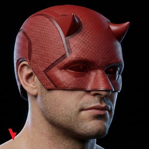 May include: A red superhero mask with a textured surface and two small horns on top. The mask covers the eyes and nose, with a dark background.