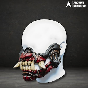 May include: A detailed, red, black, and gold Oni half-mask with sharp teeth, displayed on a white mannequin head. The mask features intricate detailing and is a striking piece of cosplay or decorative art. The Archive Design 3D logo is visible.