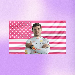 May include: A rectangular wall flag featuring a pink and white horizontal striped pattern with a pink and white star-spangled canton. Centered in front of the flag is a portrait of a person wearing a white long-sleeved racing suit with logos.