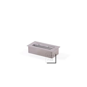 May include: A rectangular, stainless steel bio ethanol fireplace. The fireplace has a recessed design with a rectangular opening. The brand name "STAR FIRE" is printed on the lower right corner.