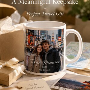 May include: White ceramic mug featuring a photo of a couple in Tokyo, Japan, with the text "Tokyo Memories" and the names "Ava & Liam." The mug is surrounded by gift boxes, a tag that says "Made for Special Memories," and a postcard.